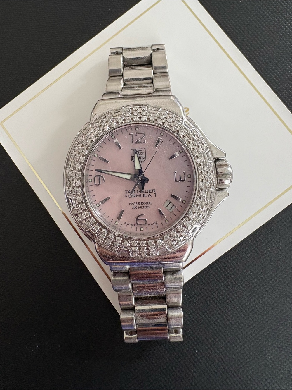 TAG Heuer Formula 1 Lady quartz watch featuring a diamond bezel and a pink dial